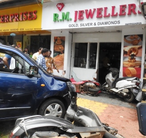 Car crashes into store at Aquem