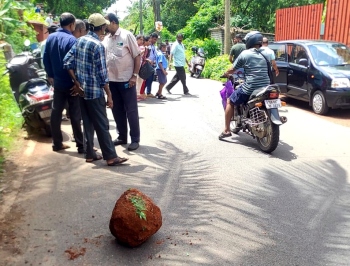 Woman, child hurt as boulder hits scooter