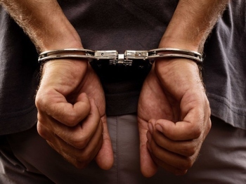 Cop booked for stalking ex-girlfriend
