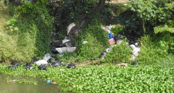 Shock & horror: Waste stacked in gunny bags dumped in river Sal near Khareband bridge