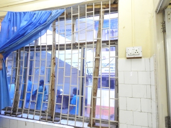 Wooden poles found supporting window slab on bldg's ground floor