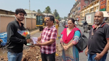In unique protest, contractor presented bouquet for digging up freshly asphalted road
