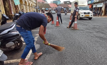 Damaged road behind MMC building kicks up dust