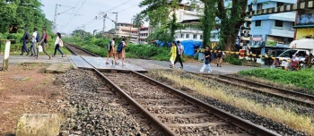 School children wave 'tirangas' in celebration of Independence, but freedom from road risk a far cry
