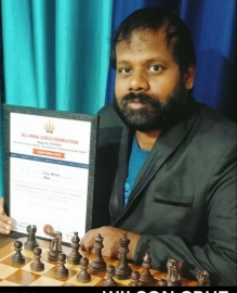 Wilson earns senior National Arbiter title