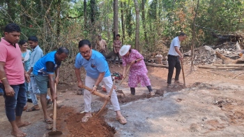 Minister leads reconstruction of house razed by fire