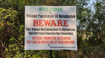 Banners warning builders and promoters not to buy land put up around Betalbatim