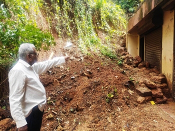 Housing complex residents fear collapse of retaining wall