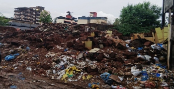 Debris of building razed 2 yrs ago turns into pile of rubble