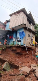 Retaining wall gives way, house in Chimbel on verge of collapse