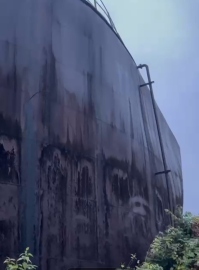 Defunct molasses tank develops cracks, leaks poisonous waste