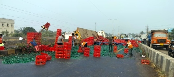Truck carrying Coca-Cola bottle crates overturns at Verna, traffic hampered