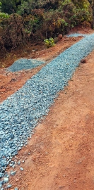 Work to lay gravel on damaged road begins at Poriem-Gholwada