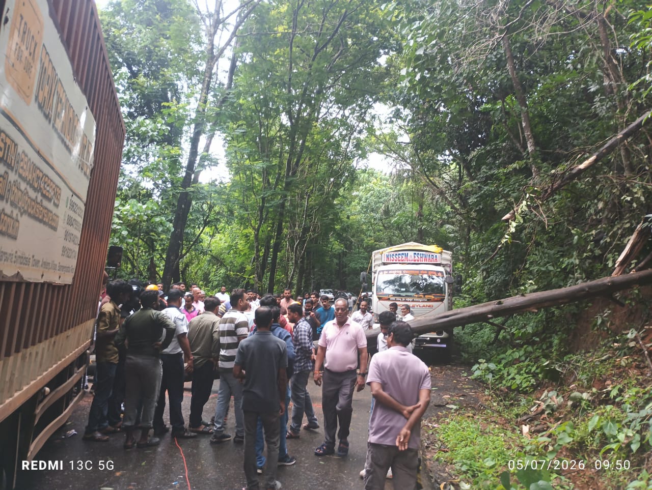 Huge fallen trees block highway near Anjunem Dam