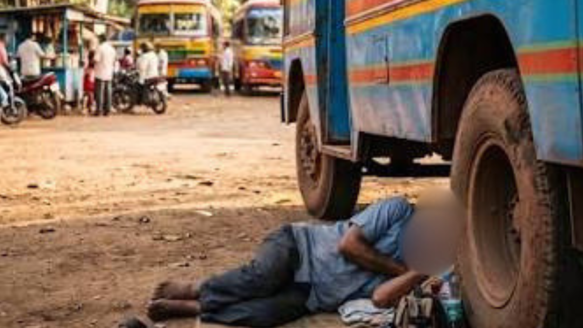 Sleeping man killed under parked bus