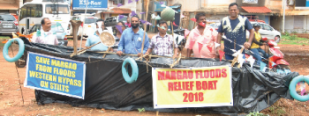 Citizens exhibit flood relief boat at Maddel, highlight dangers Western bypass would pose without stilts