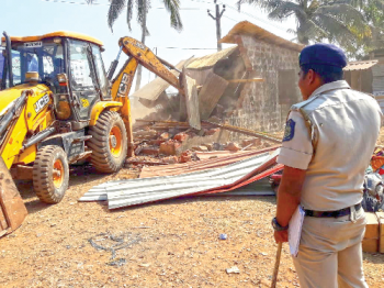 Illegal structures in low-lying area at Merces flattened amid high drama