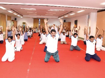 Speaker attends yoga workshop