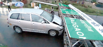Rider hurt, car damaged as huge signboard falls near airport