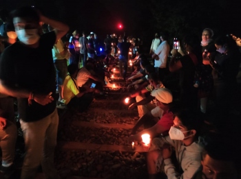Night turns bright as thousands light their way to Chandor