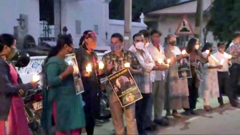 Candlelit vigil for murdered activist in Salvador do Mundo