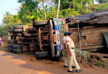 Family escapes unhurt as truck rams into house at Karapur