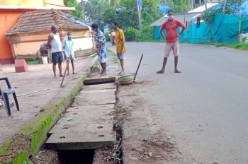 Gutters cleaned near Morjim temple