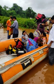 RAIN, FLOODS LEAVE A TRAIL OF DESTRUCTION