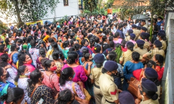 Anganwadi workers march to CM’s residence, stage dharna