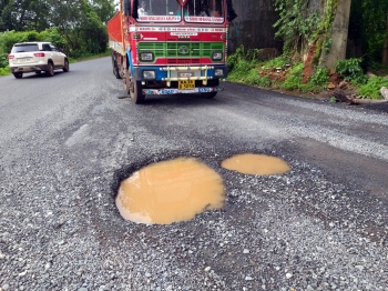 Potholes hamper traffic on NH66 at Barcem