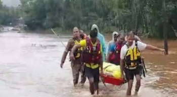 Firemen help shift body of man as Paroda house cut off due to floods