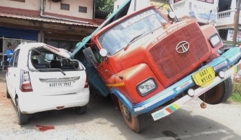 Truck falls on car after paved nullah caves in at Margao
