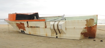Foreign boat drifts ashore at Mobor