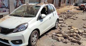 Woman injured, car damaged as portion of old building crashes down in Margao