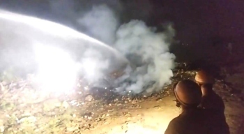 Fire engulfs waste near bus stand after midnight, reappears at 9 am