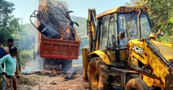 Power cable transported on truck catches fire, tragedy averted