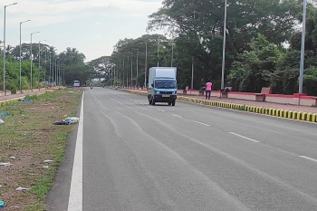 Street light poles dot Aquem ring road but remain in dark