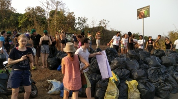 Foreign tourists collect garbage at Arambol beach, roadsides