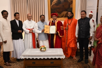 International university confers PhD on Guv