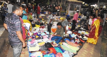 With no authority to crack a whip, street vendors make merry