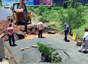 Pipeline bursts once again, part of service road caves in at Guirim