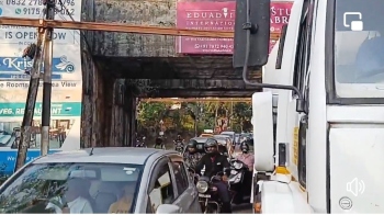 Cement mixer crashes into underpass height barrier